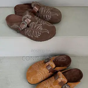 Cop the Embroidered Cowboy Clogs