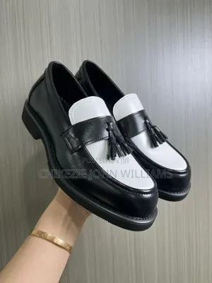 These Are Black and White Tassel Loafers With a Thick Chunky Sole.