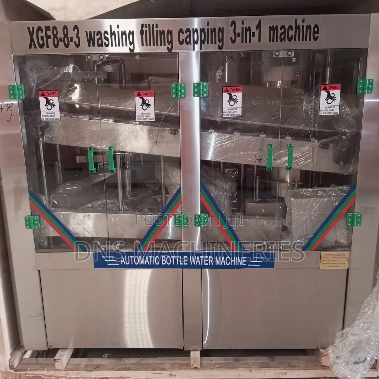 Water Bottling Machine, Rinsing, Filling and Capping.