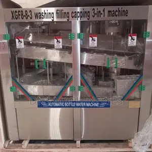 Water Bottling Machine, Rinsing, Filling and Capping.
