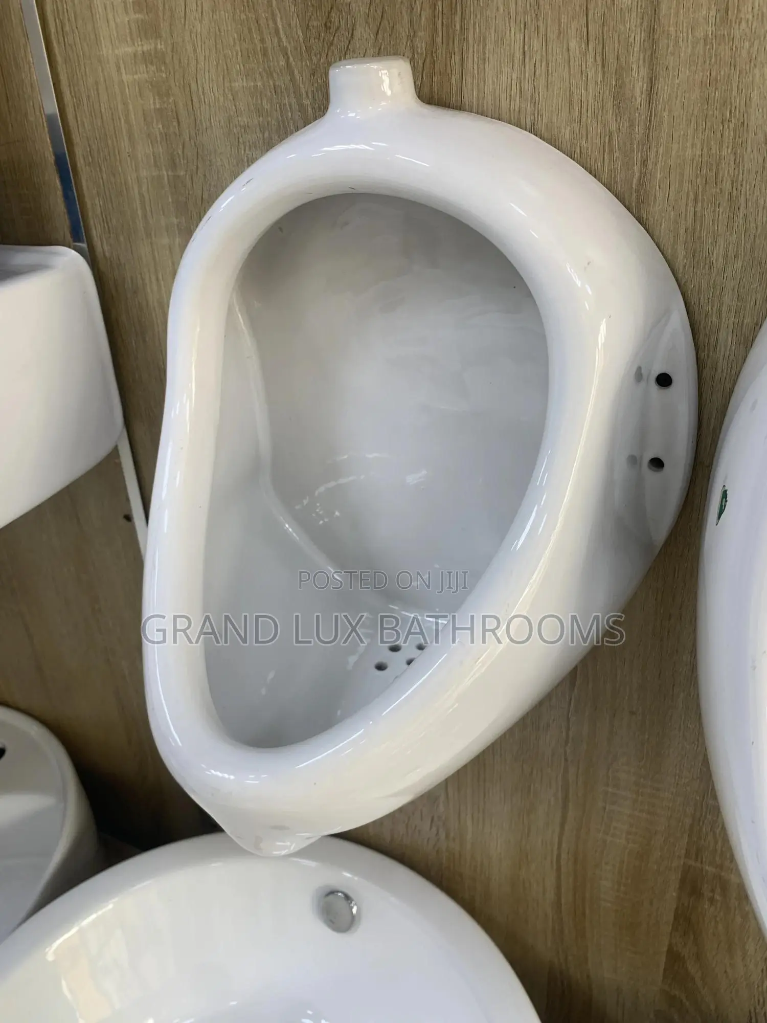 **Wall-Mounted Ceramic Urinal – Compact Design**