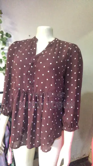Uk Thrifts Top and Adire Fabrics.