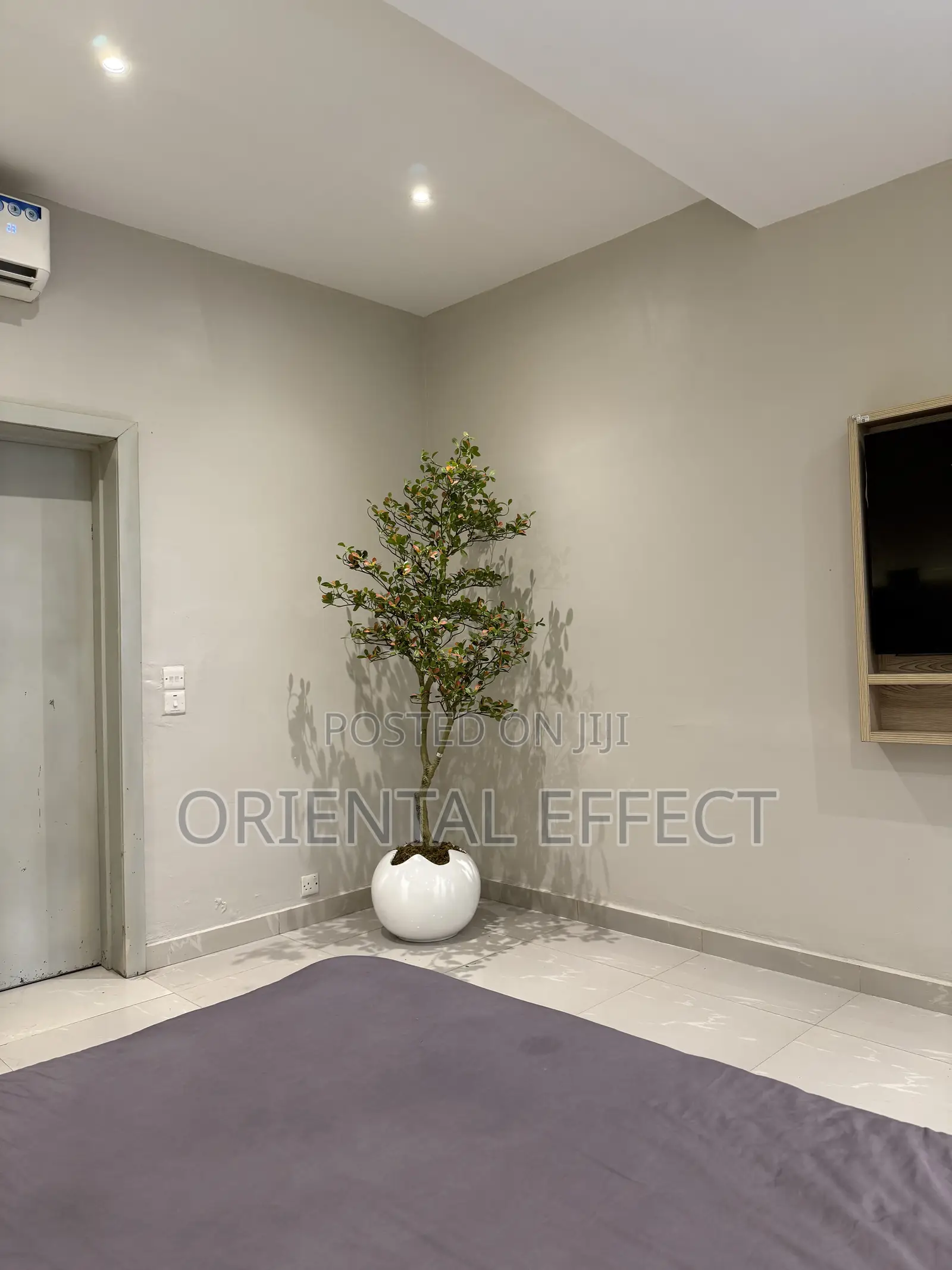 White Wobble Pot Styled With Artificial Osman Tree | Artificial Plant