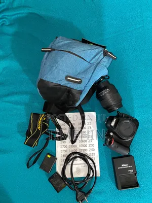 Nikon D5100 W/ Kit Lens, 2 Batteries Camera Bag