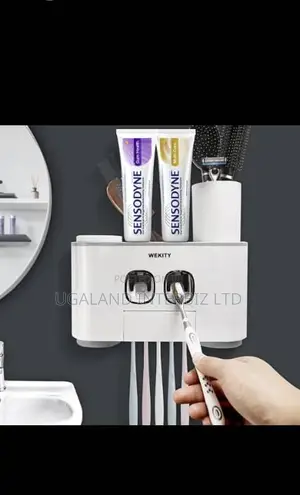 Wall Mounted Toothpaste Dispenser And Toothbrush Holder