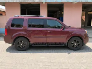 Honda Pilot Touring w/RES/Navi 4WD (3.5L 6cyl 5A) 2010 Burgundy