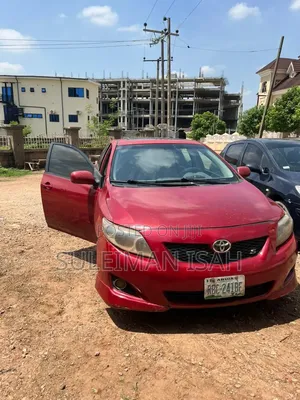 Toyota Corolla Base 4dr Sedan (1.8L 4cyl 5M) 2010 Red