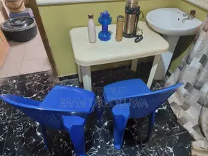 2 Plastic Chairs + 1 Plastic Table