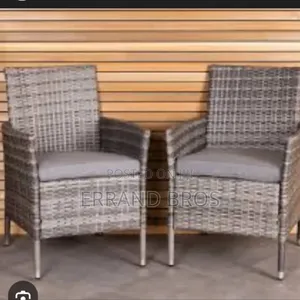A Pair of Rattan Garden Chairs With Cushion
