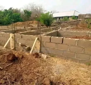 A Plot of Land With 10 Rooms Self Contain at Foundation Level