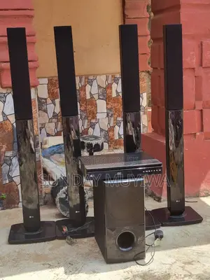 Lg Home Theater System With Four Tall Satellite Speakers, a Subwoofer