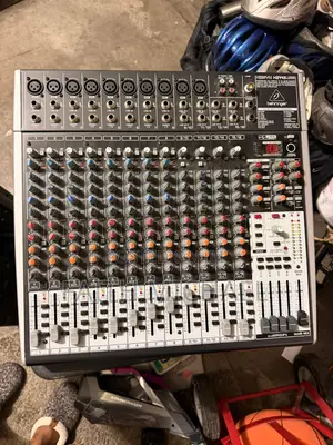Behringer Xenyx X2442usb, a Professional 24-Input Analog Audio Mixer.