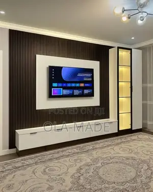 Luxury Tv Space With HDF Glossy Boards and Good Lighting
