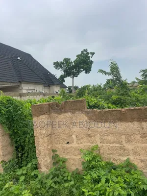 A Plot of Land at Adeleke Estate With Fence and Gate