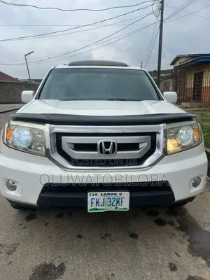 Honda Pilot Touring w/RES/Navi 4WD (3.5L 6cyl 5A) 2011 White