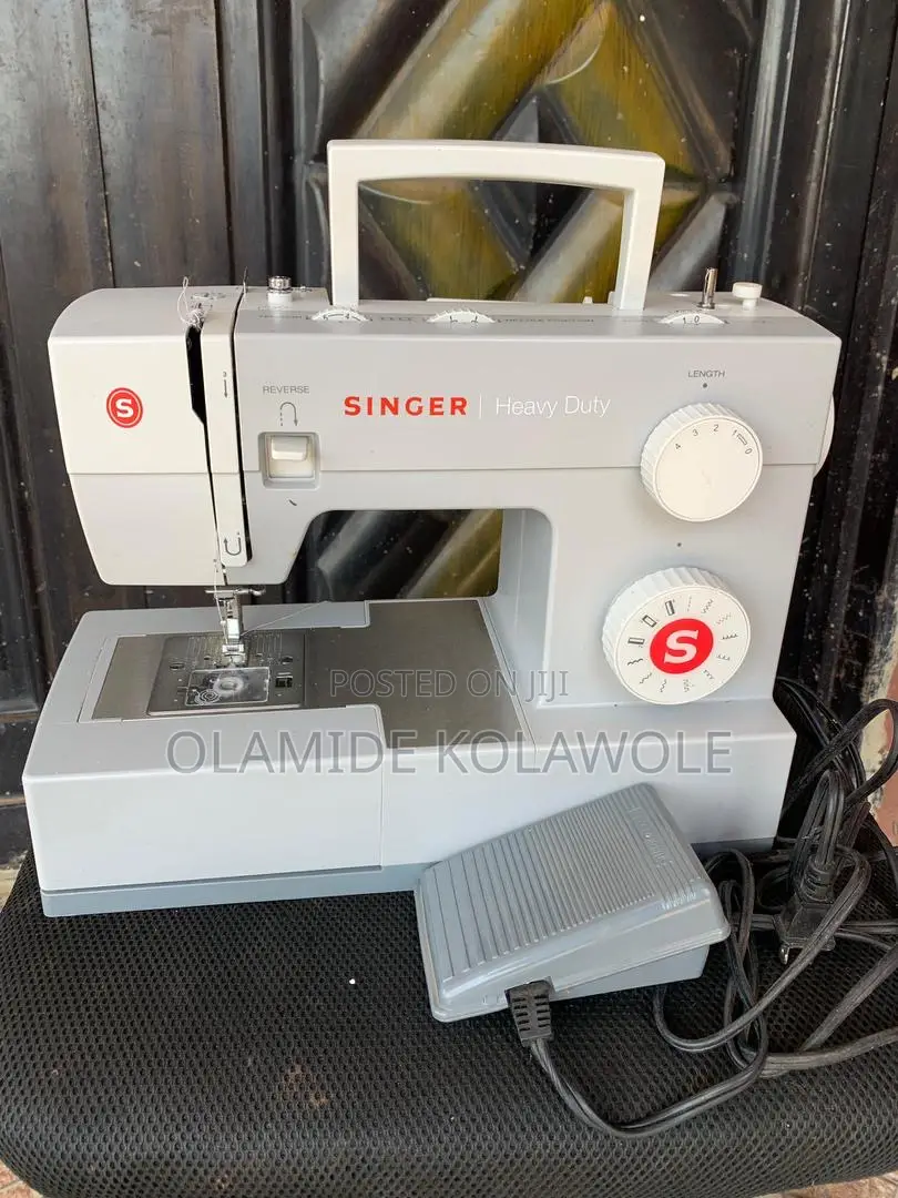An Opened Box Of Singer Heavy Duty 4411 High-speed Sewing Machine
