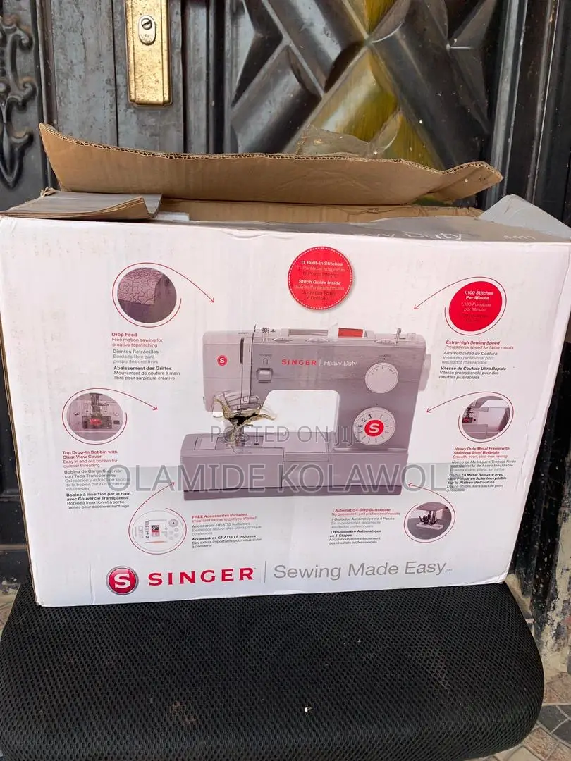 An Opened Box Of Singer Heavy Duty 4411 High-speed Sewing Machine