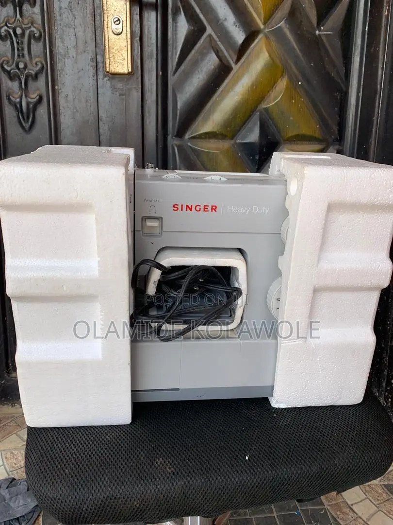 An Opened Box Of Singer Heavy Duty 4411 High-speed Sewing Machine