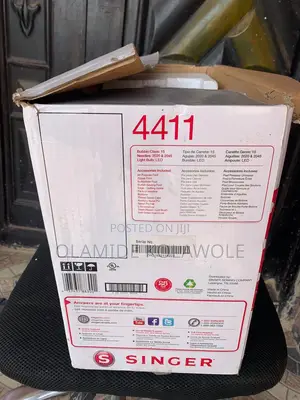 An Opened Box Of Singer Heavy Duty 4411 High-speed Sewing Machine