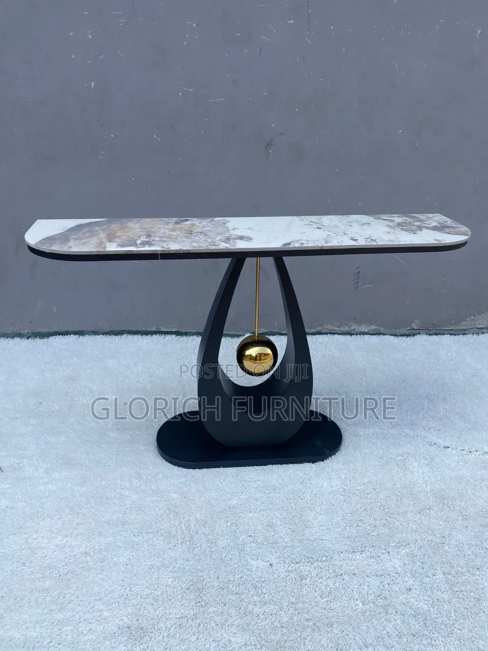 Sculptural Marble Console Table–Teardrop Black Base With Gold Pendulum