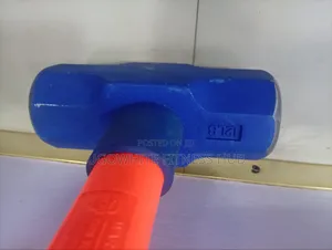 Features A 12-pound (12 Lb) Sledgehammer With A Bright Orange