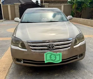 Toyota Avalon XL Sedan FWD (3.5L 6cyl 6A) 2009 Gold