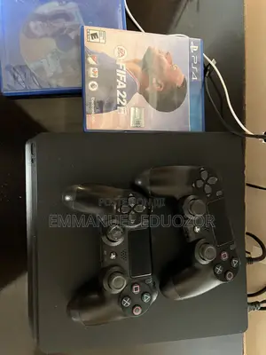 Ps4 Slim Console With Two Pads and Gta and Football Dics
