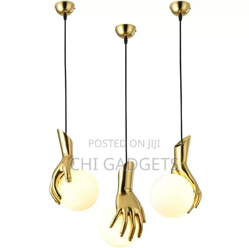 Hand Holding Globe Pendant Light