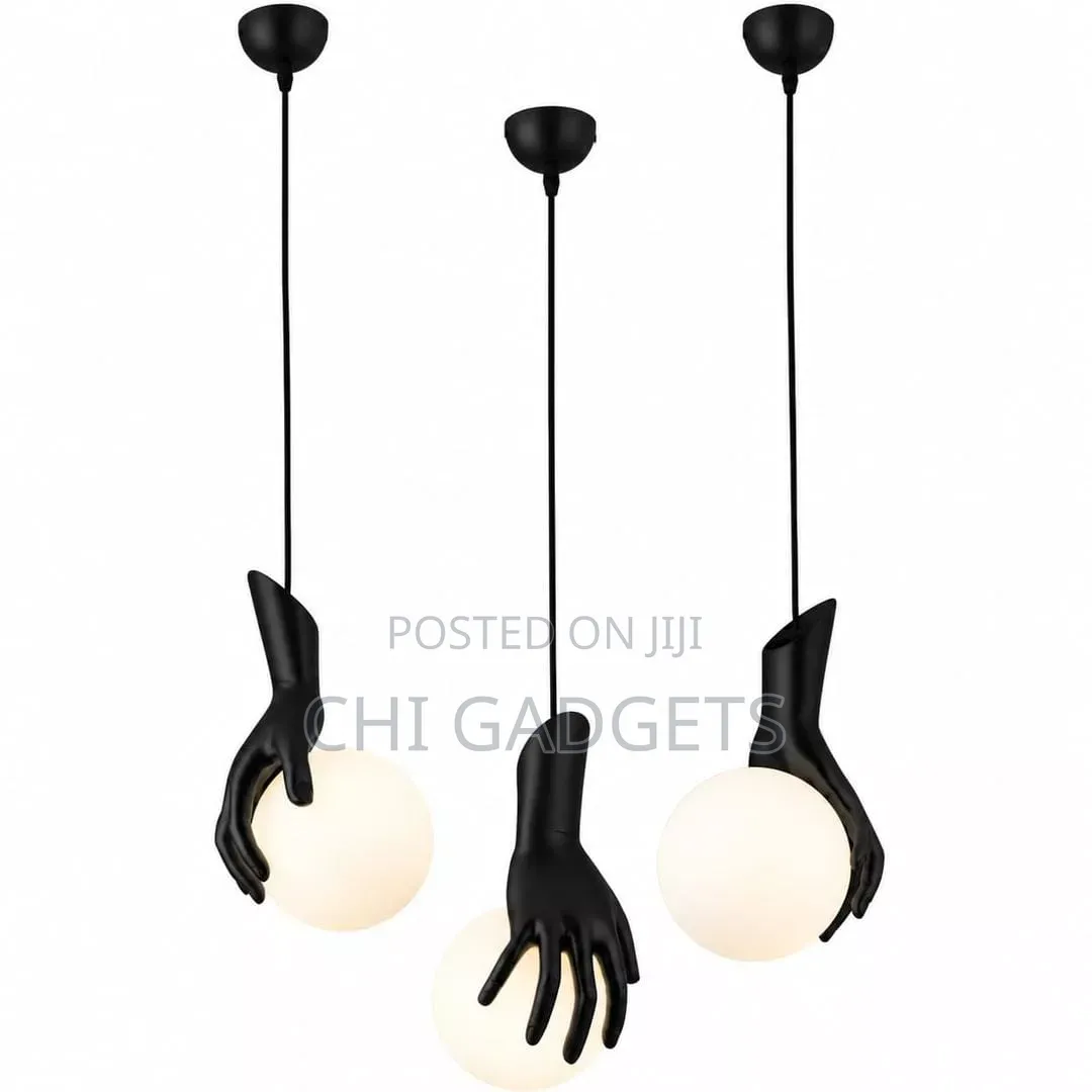 Hand Holding Globe Pendant Light