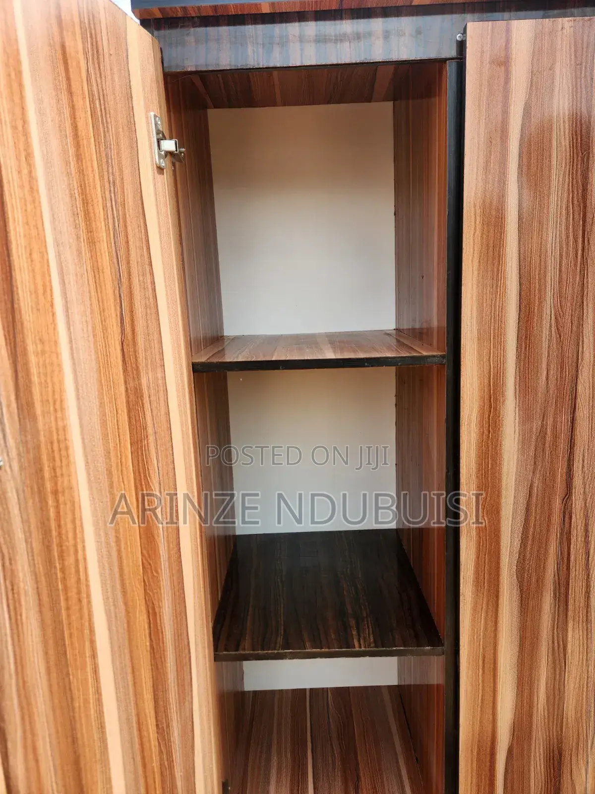 Wardrobe Features Three Doors and Two Lower Drawers