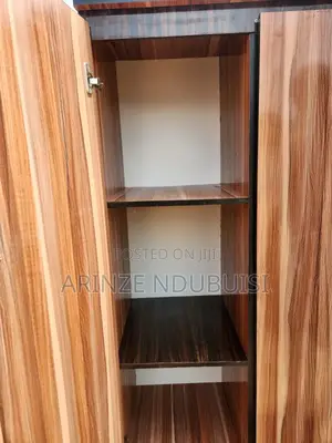 Wardrobe Features Three Doors and Two Lower Drawers