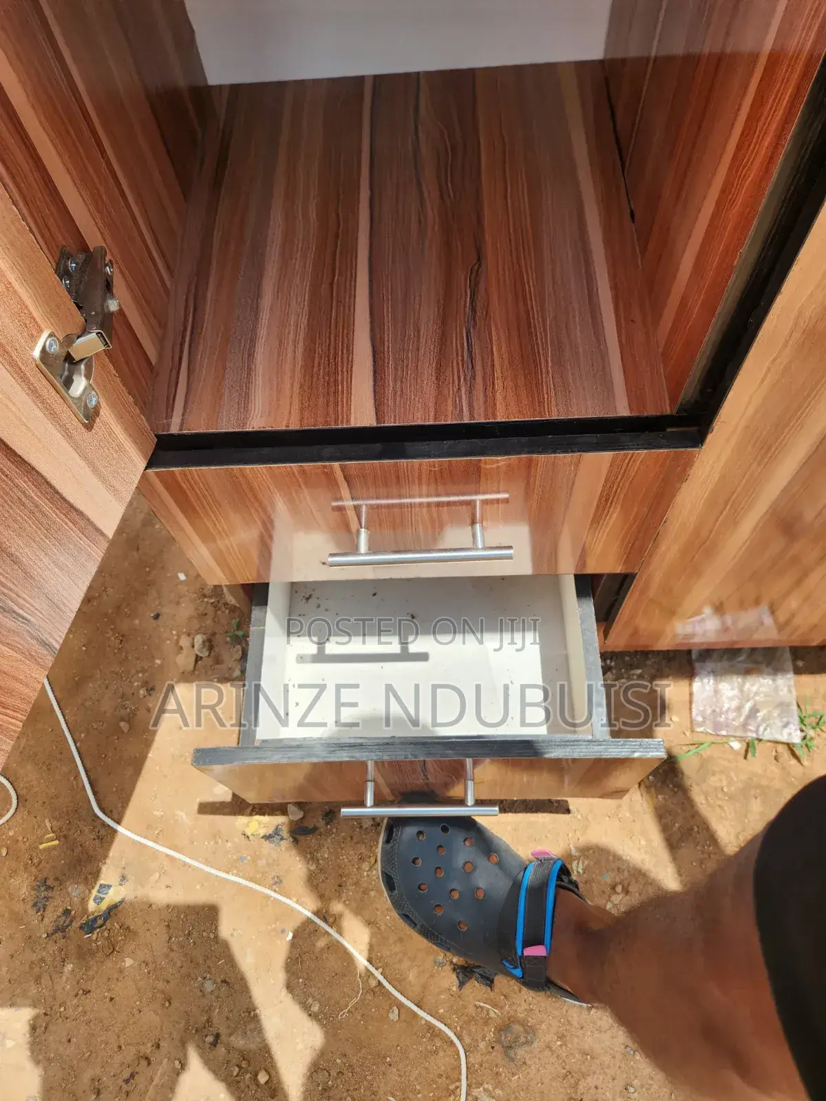 Wardrobe Features Three Doors and Two Lower Drawers