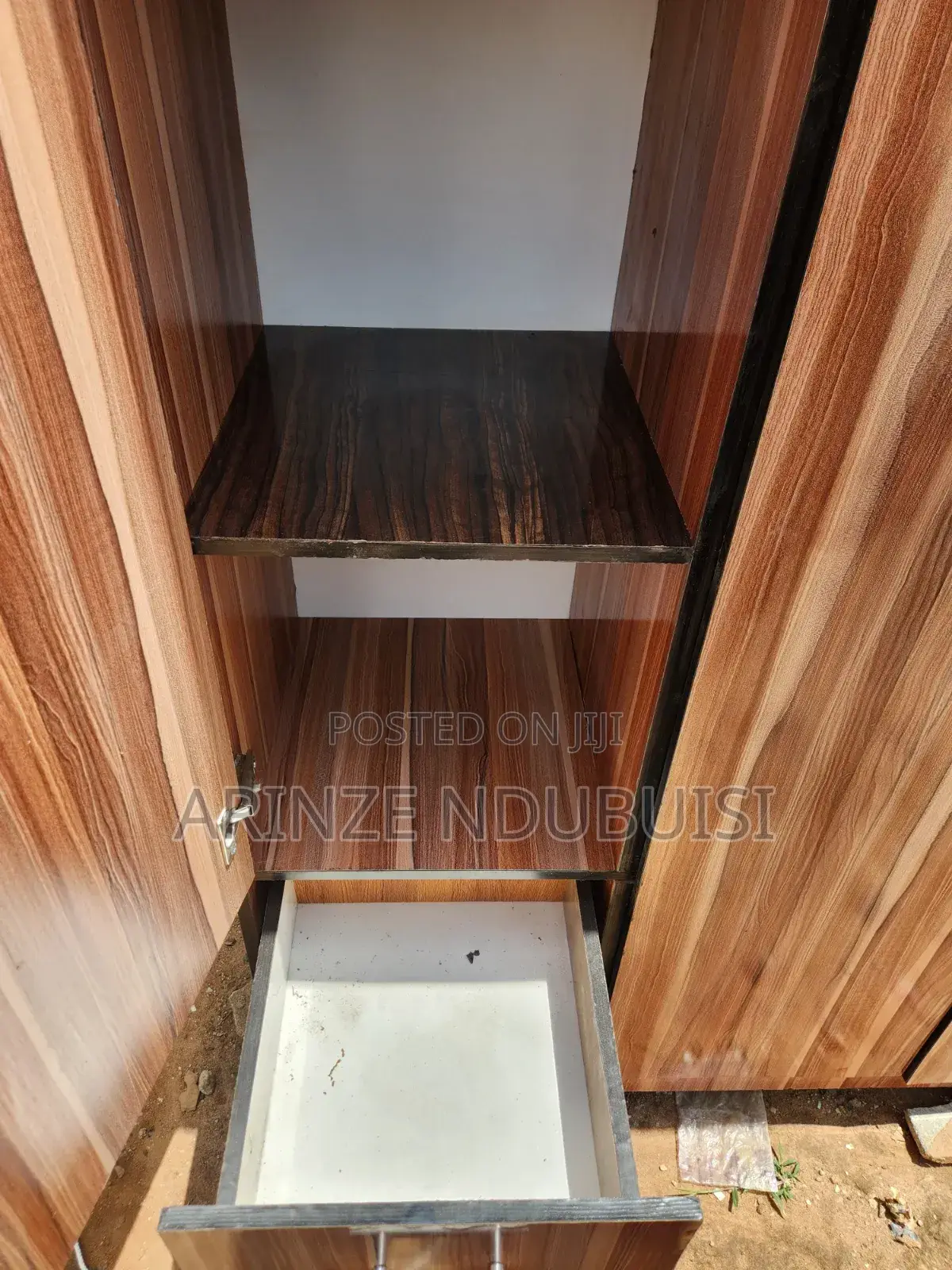 Wardrobe Features Three Doors and Two Lower Drawers