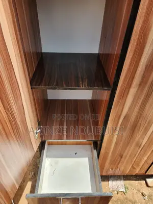 Wardrobe Features Three Doors and Two Lower Drawers