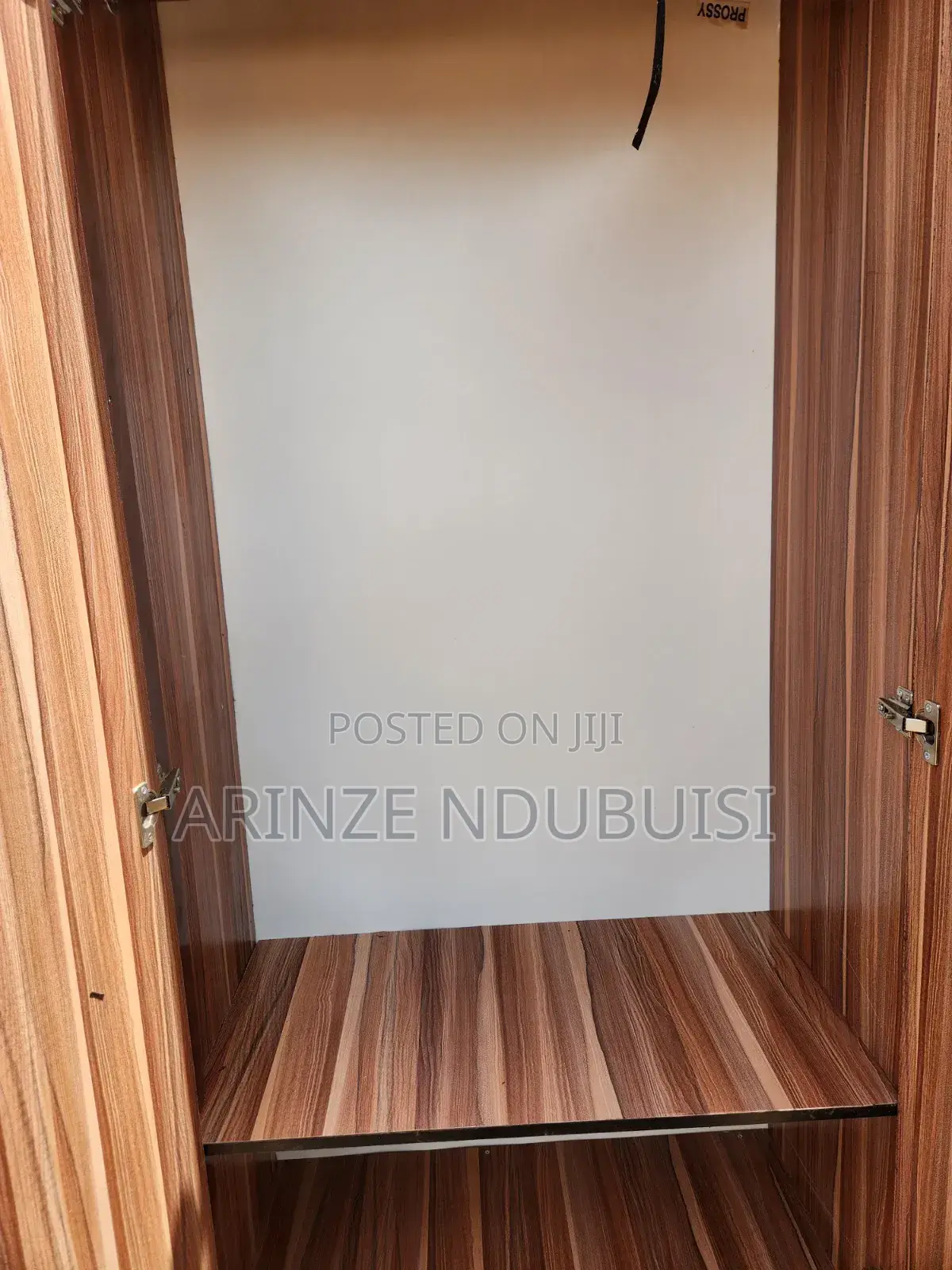 Wardrobe Features Three Doors and Two Lower Drawers