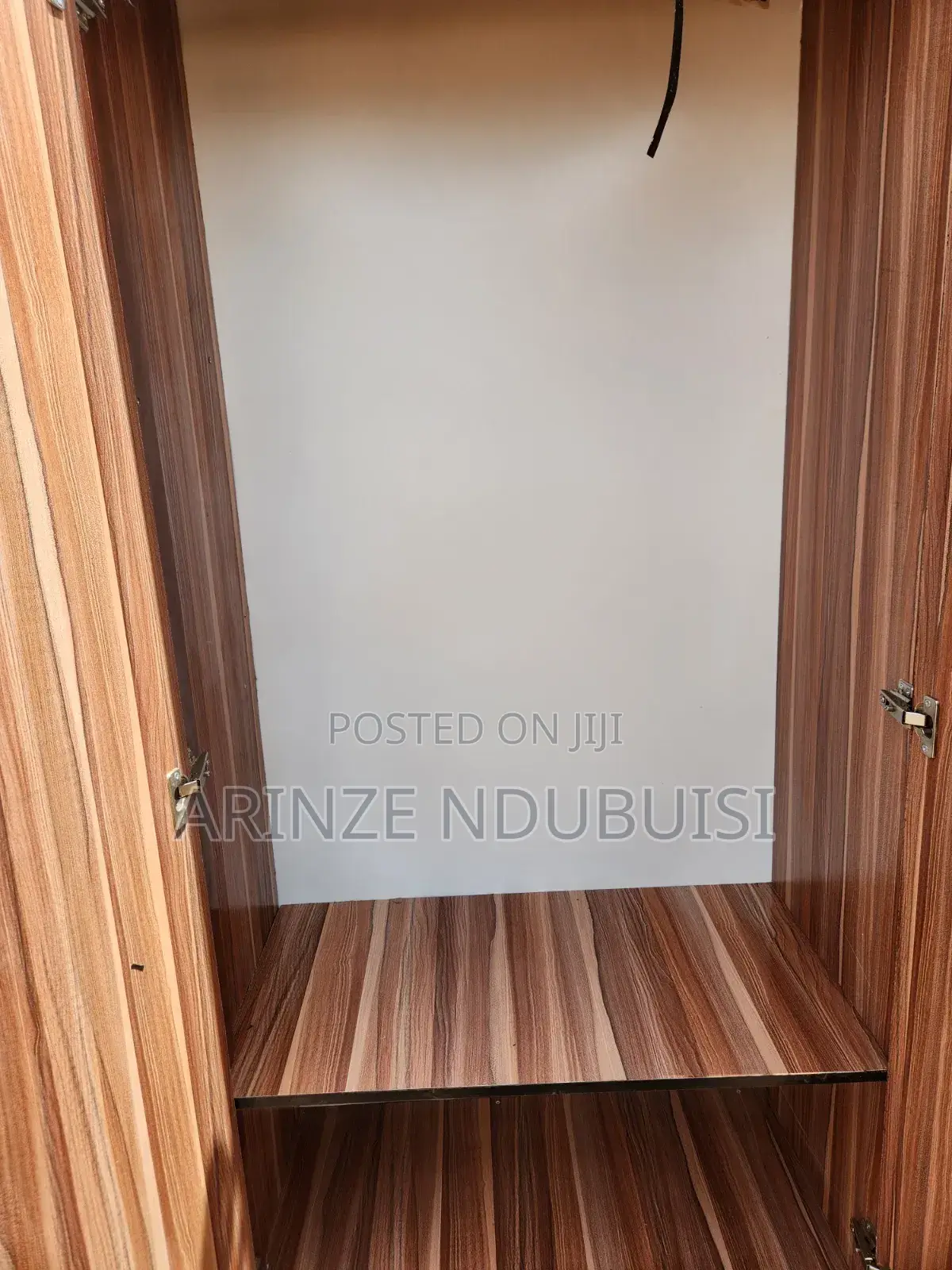 Wardrobe Features Three Doors and Two Lower Drawers