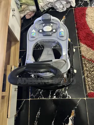 Barely Used Baby Walker With Music and Umbrella