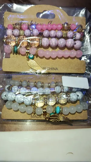 4-Piece Pink Beaded Bracelet Set With Wing Eye Charm