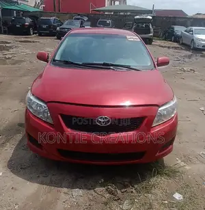 Toyota Corolla Base 4dr Sedan (1.8L 4cyl 5M) 2010 Red