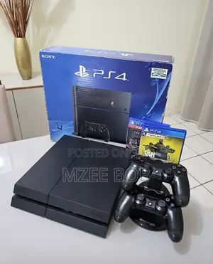 Brand New Play Station 4 Fat Console Complete With 2 Pads and Games 