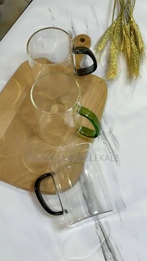 Glass Cup With Green and Black Handle