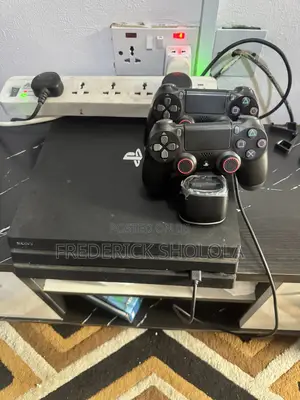 Ps4 Pro for Sale With Two Controllers and 8 CDS
