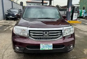 Honda Pilot Touring w/RES/Navi 4WD (3.5L 6cyl 5A) 2012 Red