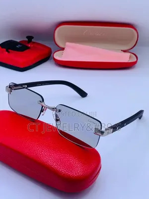 Cartier Rimless Distinctive Platinum Finish and Black Wooden Temples.