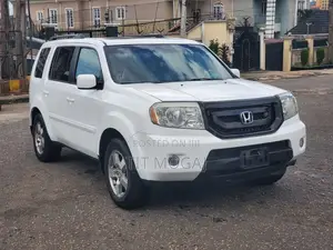 Honda Pilot Touring 4dr SUV 4WD (3.5L 6cyl 5A) 2009 White