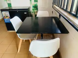 A Foreign Set Chairs and a Table