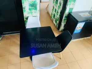 A Foreign Set Chairs and a Table