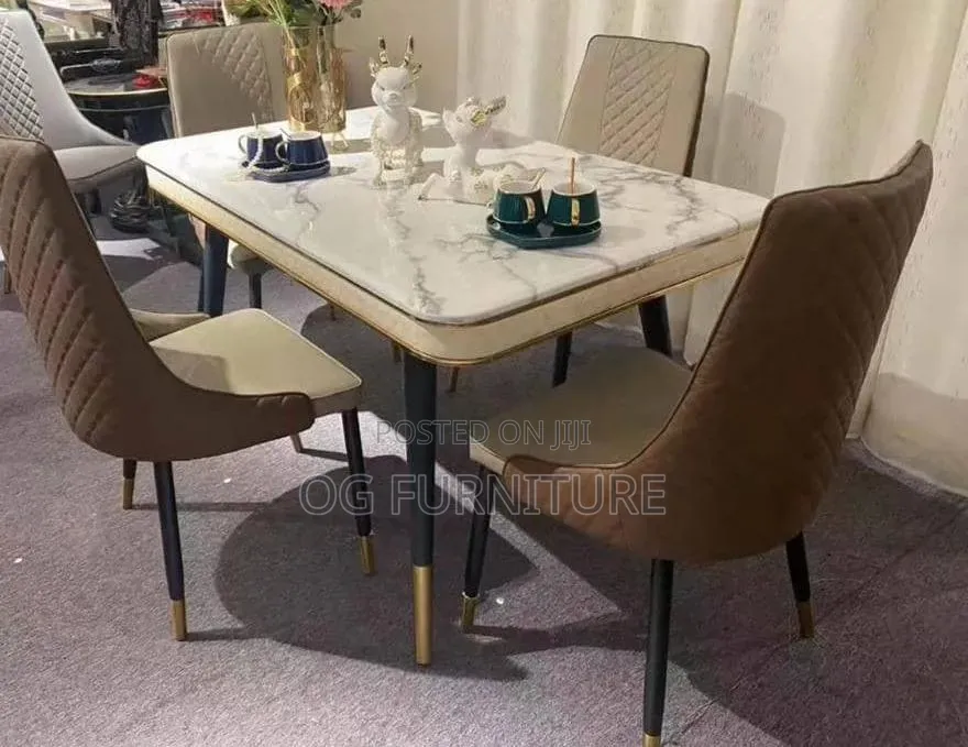 A Marble Dinning Table With Six Leather Chairs