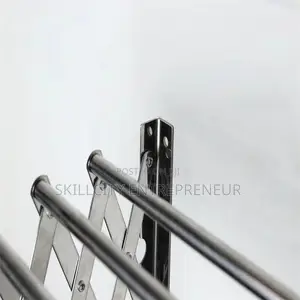 Wall-Mounted, Collapsible Clothes Drying Rack.