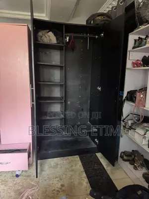 A Black Wardrobe and a Pink With 3 Compartments Sell Black-110,000